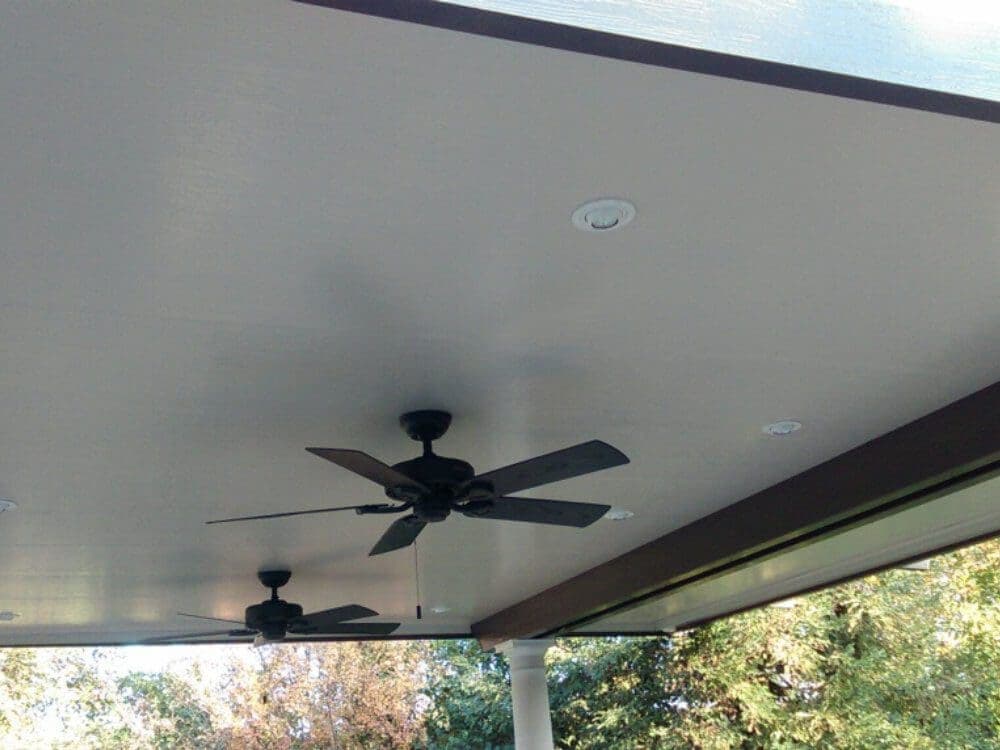 Insulated patio cover with a ceiling fan