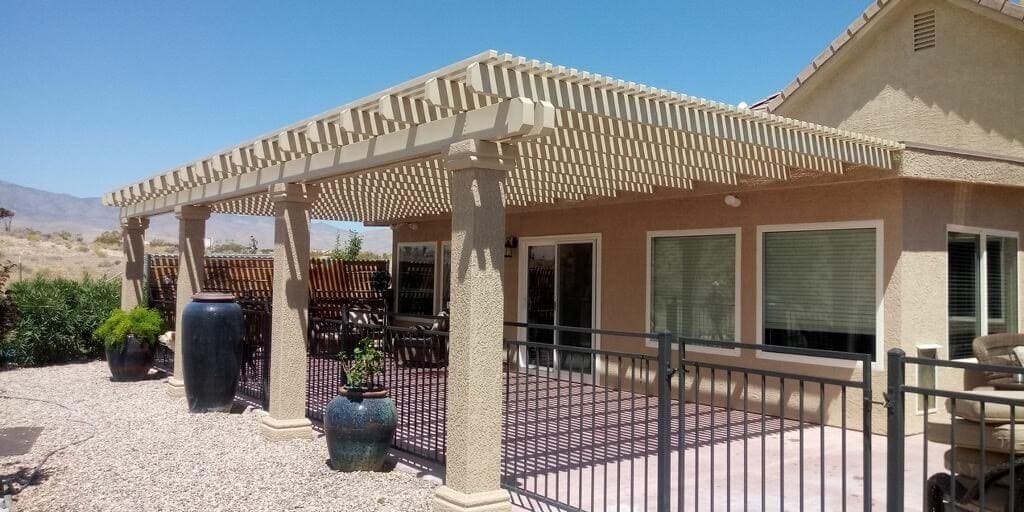 White lattice patio cover on a stucco home