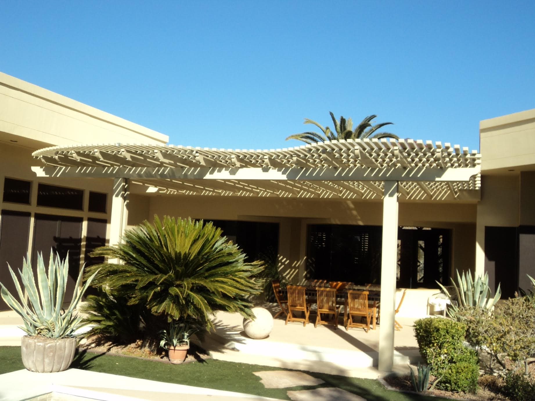 Lattice and solid combo patio cover over a covered dining patio