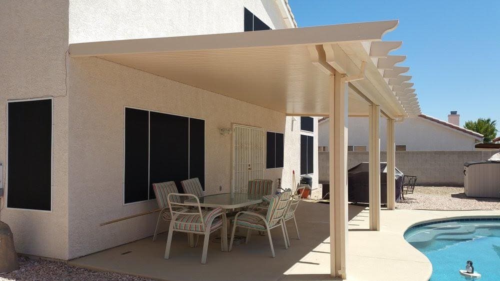 White solid patio cover over a dining set
