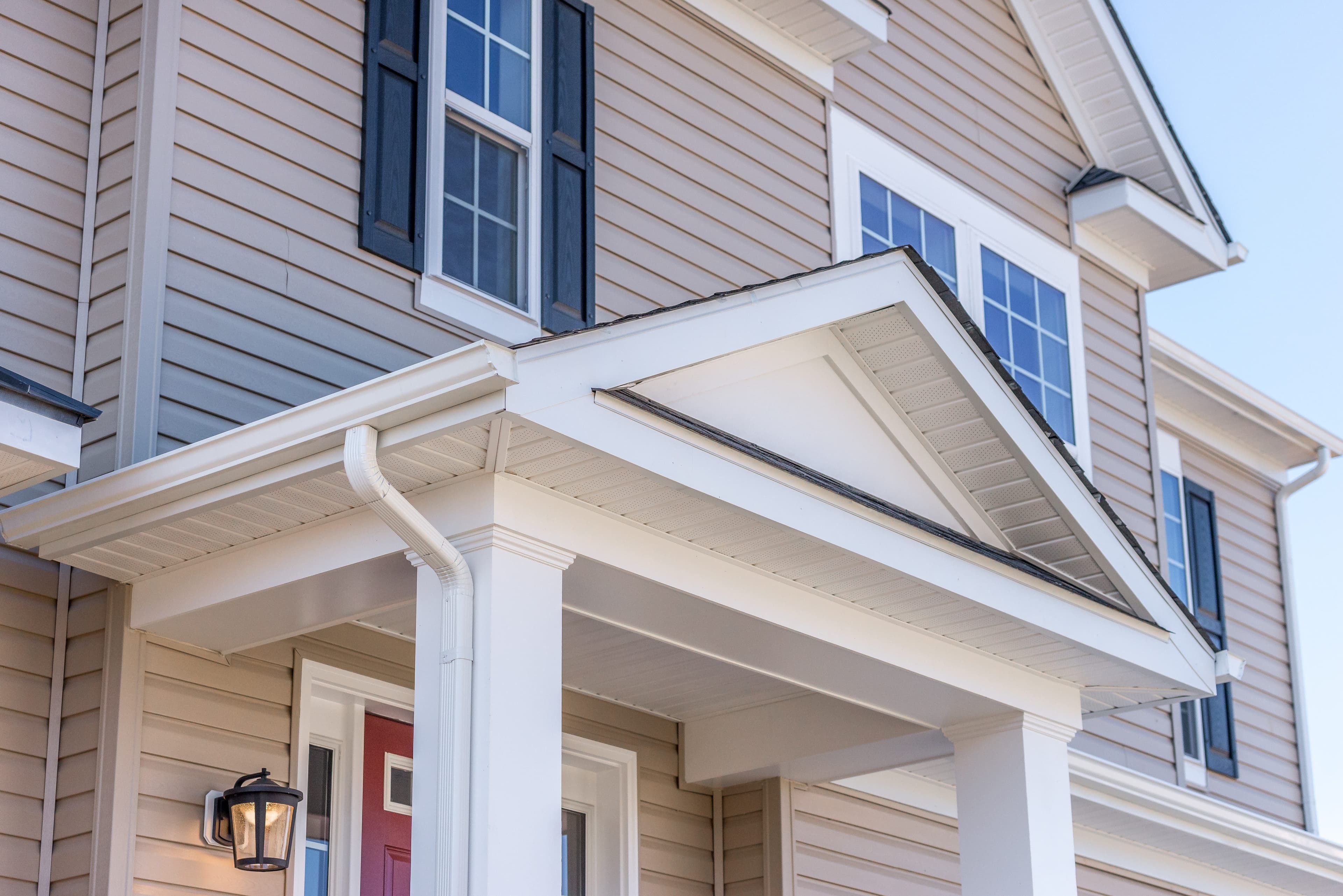 Seamless aluminum rain gutters on a two-story home