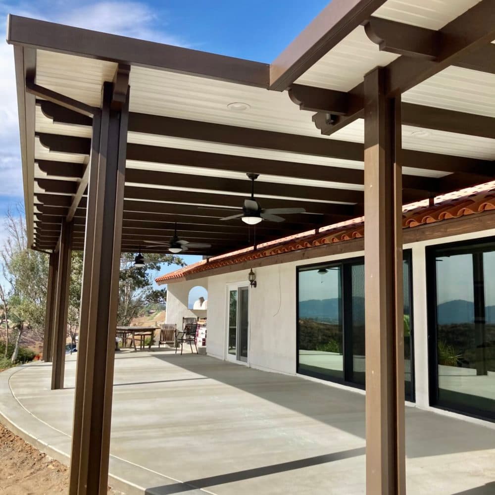 Spanish brown Alumawood roof with ceiling fans over a long patio